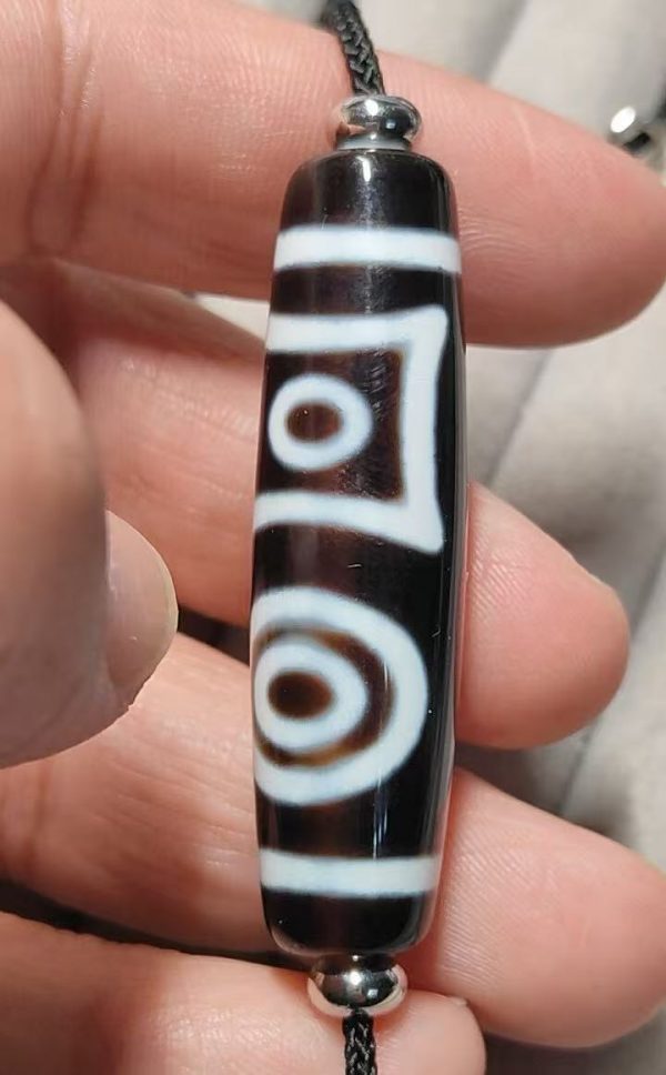1db3576337720181295089af48dcbe05 Black and white "eye within eye" Dzi bead, size 49*13mm