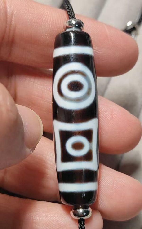 375bf15159417d95479f090b035659c2 Black and white "eye within eye" Dzi bead, size 49*13mm