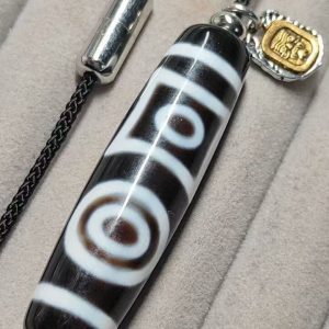 Black and white "eye within eye" Dzi bead, size 49*13mm