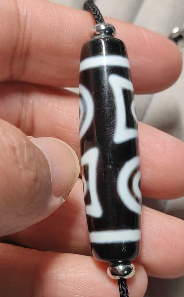 b61c2524970a9a402377d8570f352048 Black and white "eye within eye" Dzi bead, size 49*13mm